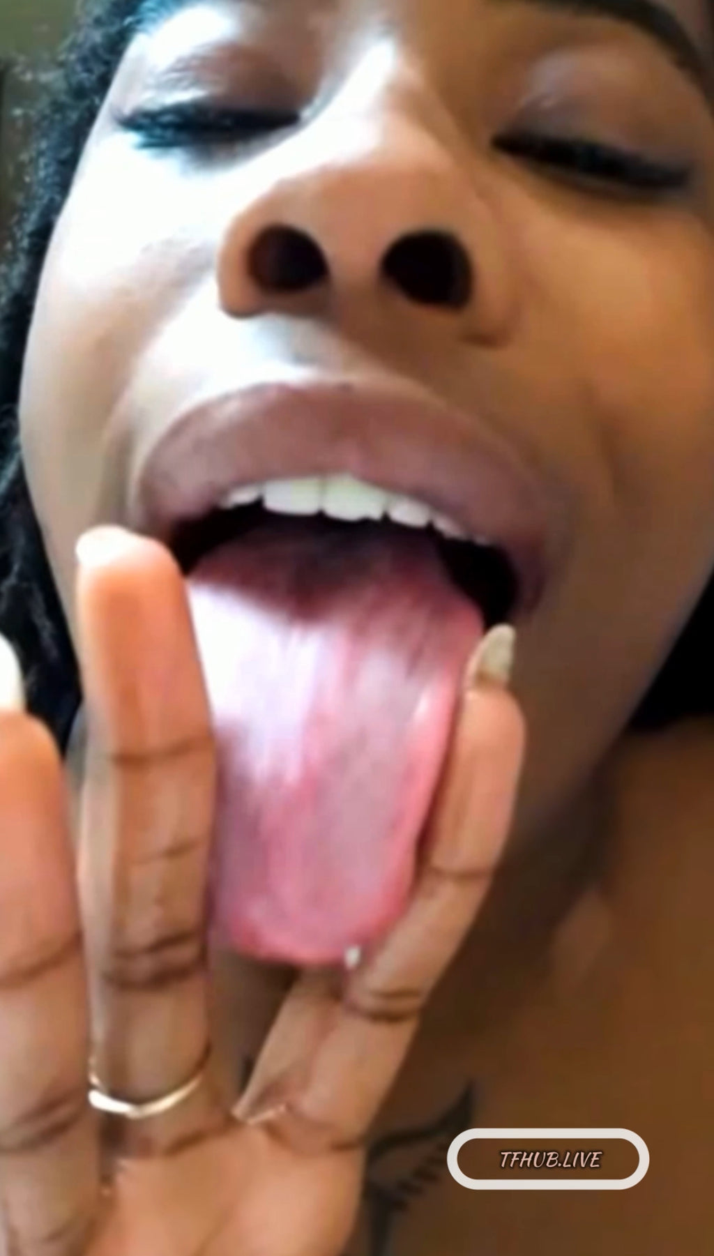 Pretty lips beauty giving tongue play, sucking her fingers deep with lots of drool.